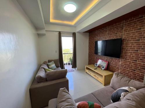 TV a/nebo společenská místnost v ubytování Kalimera Baguio Home