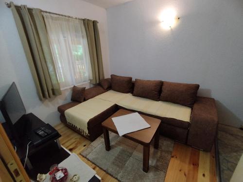 a small living room with a couch and a table at Duke in Žabljak