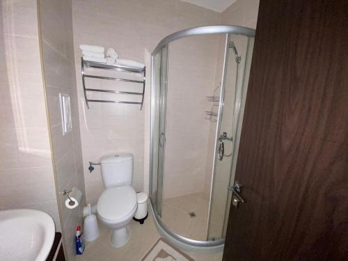 a bathroom with a shower and a toilet and a sink at LUXURIOUS COMFORT IN CASCADAS in Sunny Beach
