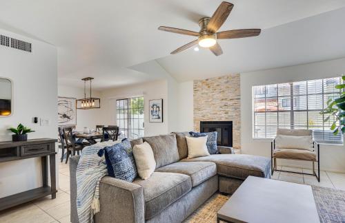 a living room with a couch and a fireplace at 92nd 1104 Scttsdale townhouse in Scottsdale