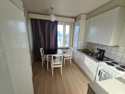 A kitchen or kitchenette at Rytitornit Apartment B12