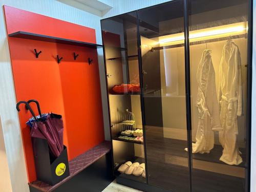 a walk in closet with an umbrella and shoes at Eagle Town Serviced Apartment- Free Pick up from Airport in Ulaanbaatar