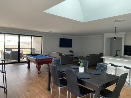 a living room with a ping pong table in it at Entire 4 bedroom home on Connolly in Bathurst in Kelso