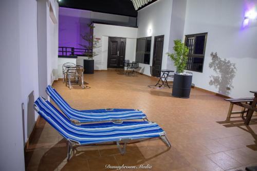 a room with a blue and white towel on the floor at Impeccable 1-Bedroom Furnished Apartment in Accra in Accra