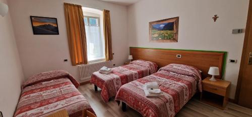 Letto o letti in una camera di Soggiorno Dolomiti