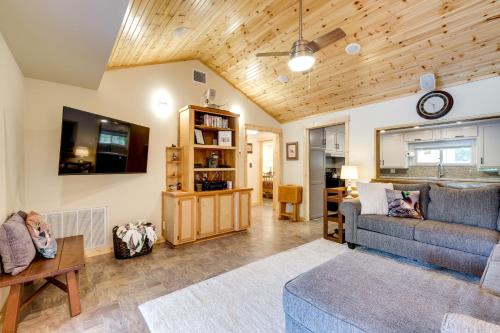 a living room with a couch and a tv at Lakefront College Station Home Near Texas A and M! in College Station