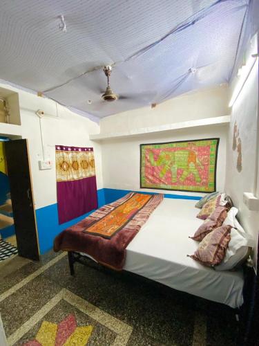 a bedroom with a bed in a room at Mirvana Guest House & Camel safari in Jaisalmer