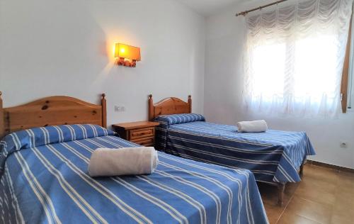 Katil atau katil-katil dalam bilik di Apartaments Les Dunes