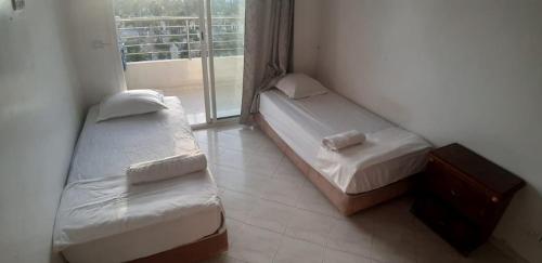 Un pat sau paturi într-o cameră la Super appartement avec vue sur mer