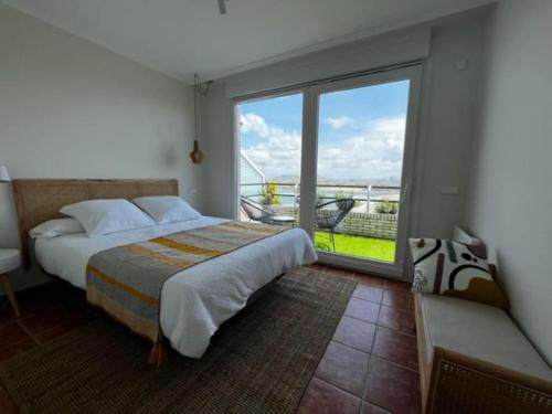 Ένα ή περισσότερα κρεβάτια σε δωμάτιο στο La Coteruca Beach