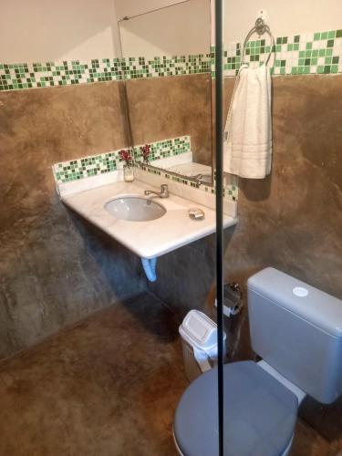 a bathroom with a sink and a toilet at Stay Cool Pipa in Pipa
