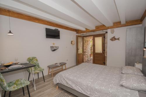 Postel nebo postele na pokoji v ubytování DeCoR Kut