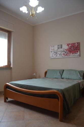 Кровать или кровати в номере La casa di Ada
