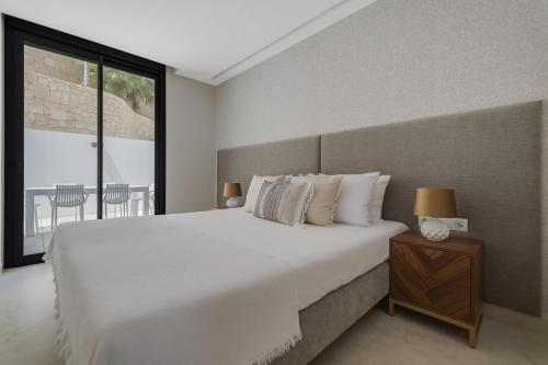 Posteľ alebo postele v izbe v ubytovaní SUNRISE BENIDORM by Costa Activa Rentals