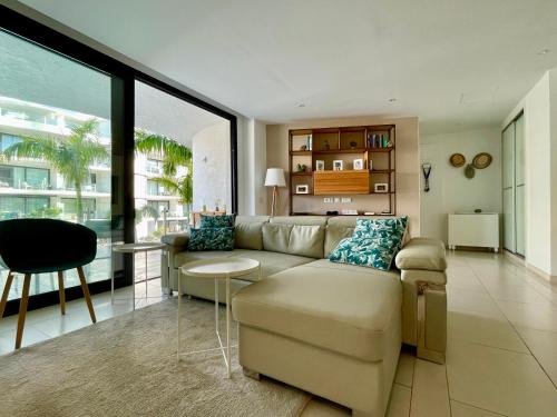 a living room with a couch and a table at Casa Las Olas in Palm-mar