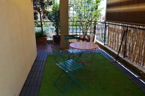 a patio with a table and chairs on a balcony at Domi - Appartamento Roma in Rome