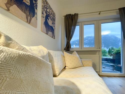a living room with a couch and a window at Haus Sabine in Leutasch