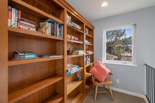 a room with wooden shelves and a chair and a window at The Cachalot MCA#4046 in Manzanita