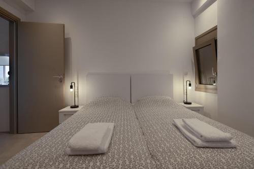 Ένα ή περισσότερα κρεβάτια σε δωμάτιο στο Milonas Home