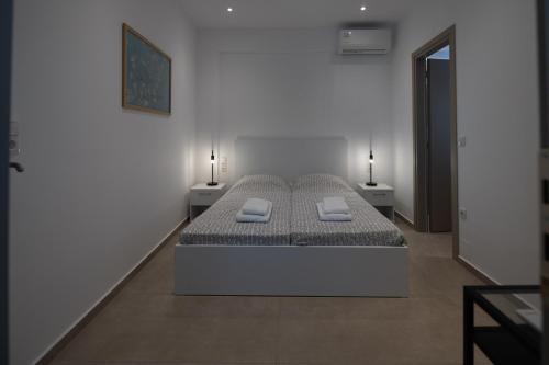 Ένα ή περισσότερα κρεβάτια σε δωμάτιο στο Milonas Home