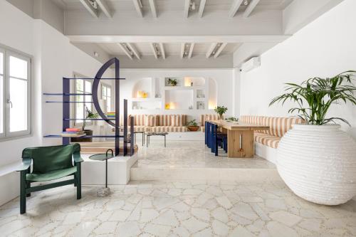 a living room with a couch and a table at Argonauta Hotel in Parikia