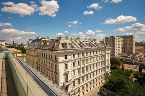 a large white building on top of a building at The Ritz-Carlton, Vienna in Vienna