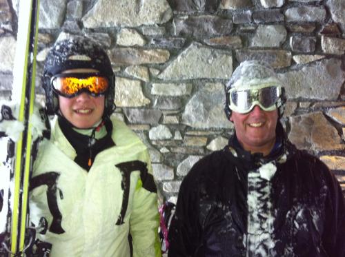 two people standing in the snow with their skis at Black Diamond Sainte Foy Chalets in Sainte-Foy-Tarentaise