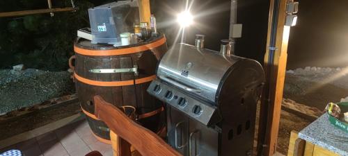 a grill sitting on top of a table at Seoski Turizam Feniks - apartman Ostrog in Kosjerić