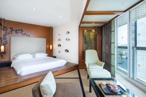 Ένα ή περισσότερα κρεβάτια σε δωμάτιο στο Sheraton Dubai Creek Hotel & Towers