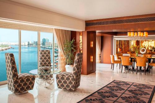 a dining room with a view of the ocean at Sheraton Dubai Creek Hotel & Towers in Dubai