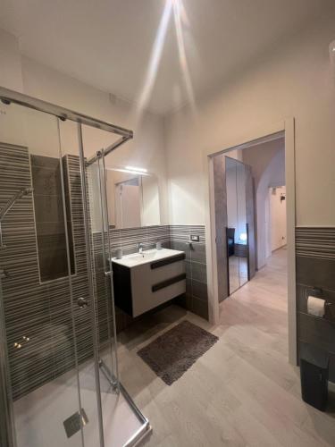 a bathroom with a sink and a shower at Guest House Villanova in Cagliari