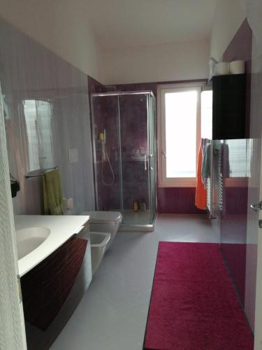 a bathroom with a tub and a sink and a shower at B&B dei Girasoli in Trani