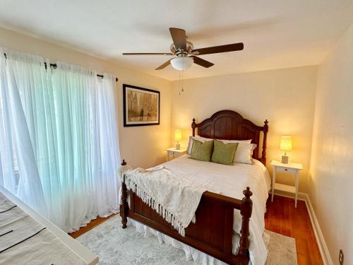 a bedroom with a bed and a ceiling fan at Cozy, Private Loft 15 min away from Downtown Detroit in Grosse Pointe Park