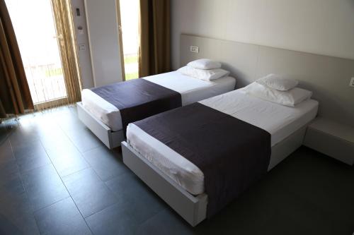 Tempat tidur dalam kamar di Enigma Resort