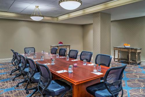 a large conference room with a large table and chairs at Sheraton North Houston at George Bush Intercontinental in Houston