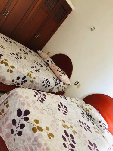 a bedroom with a bed with pillows on it at VILLAS RIBERA DEL PACIFICO in Ixtapa