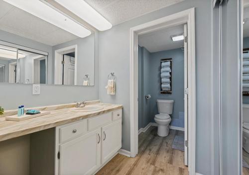 a bathroom with a sink and a toilet at Peaceful Gatlinburg Downtown Condo - 10 Mins Walk to Main Strip in Gatlinburg