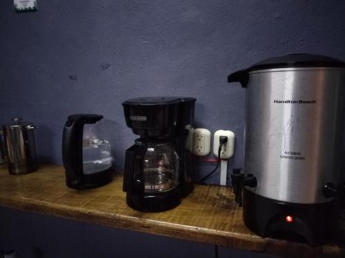 a coffeemaker and a coffee maker on a counter at Hostel Casa Xtakay in Valladolid