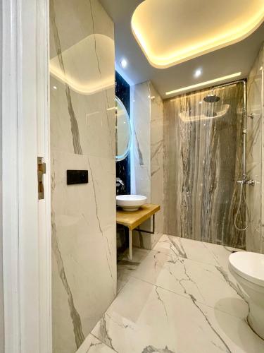 a bathroom with a toilet and a sink at BellaVista walls House in Tangier