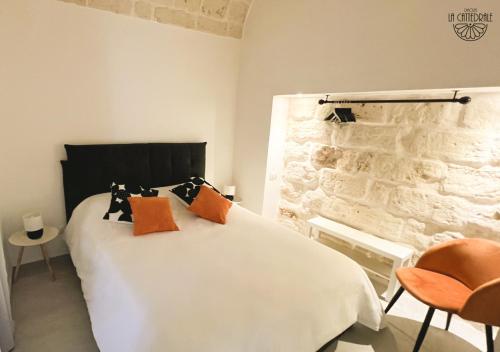 מיטה או מיטות בחדר ב-Dimora La Cattedrale
