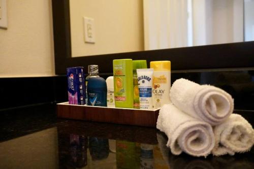 a tray with towels and other products on a counter at New Apartment in Houston in Houston