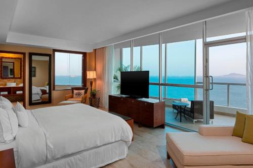 a hotel room with a bed and a television at The Westin Playa Bonita Panama in Playa Bonita Village
