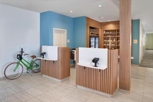 a bike parked in a room with two booths at Element Edmonton West in Edmonton