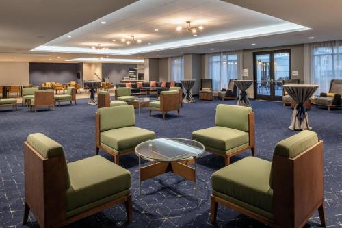 a waiting room with chairs and a table at Courtyard by Marriott Santa Cruz in Santa Cruz