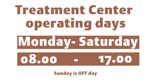 a sign that reads treatment center operating days mondayaturday and sunday is off at Karvan Sanatorium Naftalan in Naftalan