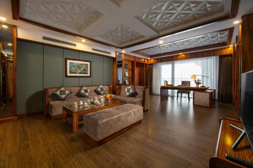 a living room with a couch and a table at Bamboo Sapa Hotel in Sa Pa