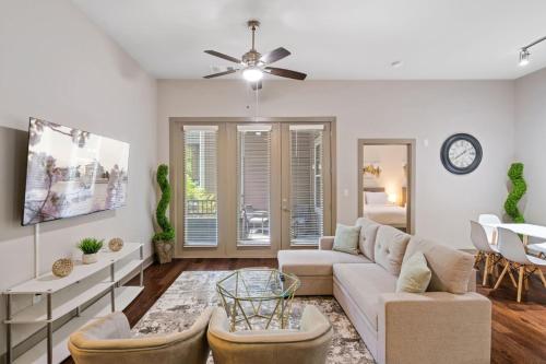 a living room with a couch and a table at Grand Luxury Premium Vaulted Ceilings in Woodbridge