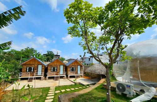 a group of cottages in a glass dome at Lacasa home&coffee Mộc Châu in Mộc Châu