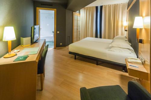 Säng eller sängar i ett rum på Hotel Barcelona Universal
