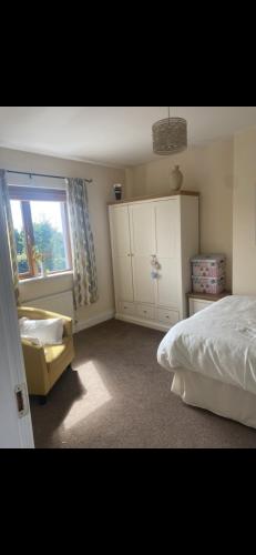 a bedroom with a bed and a window at Cosy home in Dungarvan